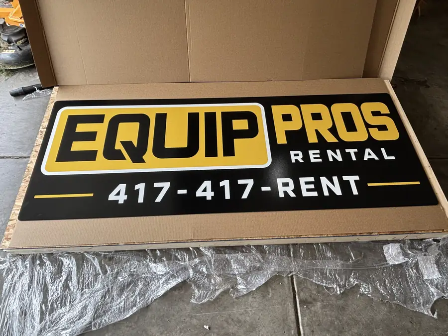 Black and yellow Equip Pros Rental ACM aluminum signs