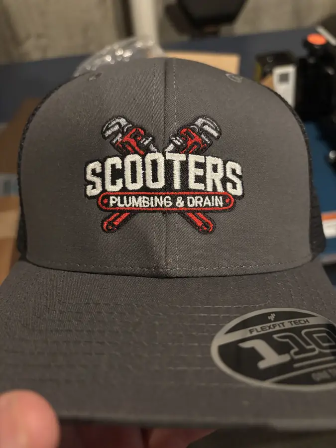 Gray embroidered hat with Scooters Plumbing & Drain logo